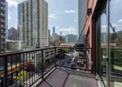 Thumbnail 34 of 41 - a balcony with a view of the city