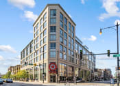 Thumbnail 32 of 33 - a tall building with many windows and a red target sign in front of it at Lakeview 3200 Apartments, Illinois