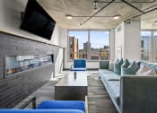 Thumbnail 31 of 33 - a living room with a fireplace and a large window at Lakeview 3200 Apartments, Chicago, Illinois