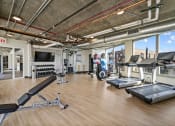 Thumbnail 28 of 33 - a workout room with treadmills at Lakeview 3200 Apartments, Illinois