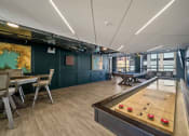 Thumbnail 23 of 33 - a games room with a ping pong table and a foosball table at Lakeview 3200 Apartments, Illinois, 60657