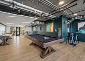Thumbnail 27 of 33 - a game room with a pool table and ping pong table at Lakeview 3200 Apartments, Chicago, Illinois