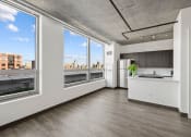 Thumbnail 2 of 33 - a kitchen with a large window and a view of a city at Lakeview 3200 Apartments, Chicago, IL, 60657