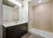 Thumbnail 20 of 33 - a bathroom with a sink and a bathtub at Lakeview 3200 Apartments, Chicago, Illinois