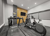Thumbnail 1 of 17 - A treadmill and a stationary bike are in a room with a wooden panel wall.