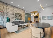Thumbnail 8 of 17 - A modern living room with a patterned wallpaper and a variety of seating options.