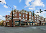 Thumbnail 6 of 17 - A street view of a building with the name "Per Faces" on it.