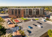 Thumbnail 16 of 34 - an aerial view of a parking lot and a building