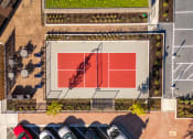 Thumbnail 10 of 34 - an aerial view of a tennis court in a parking lot