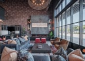 Thumbnail 1 of 34 - a living room with couches and chairs and a fireplace