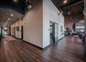 Thumbnail 5 of 34 - a large lobby with white walls and wood floors