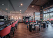 Thumbnail 2 of 34 - a dining room with tables and chairs and a bar