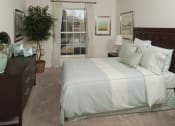 Thumbnail 10 of 16 - Bedroom with cozy bed at Versailles on the Lakes Schaumburg, Illinois