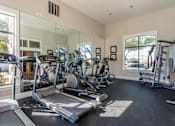 Thumbnail 15 of 32 - A spacious apartment gym with treadmills, exercise bikes, and other equipment at 1601 Eastchase Pkwy in Fort Worth, TX.