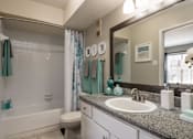 Thumbnail 6 of 32 - An apartment bathroom with a white toilet, a sink, and a shower at 1601 Eastchase Pkwy in Fort Worth, TX.