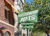 Thumbnail 36 of 51 - A green sign that says Brookmore Apts on it.