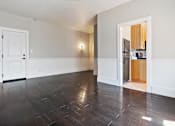 Thumbnail 19 of 51 - A studio apartment with a white door and a wooden floor at Brookmore.