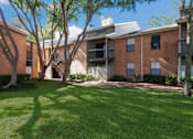 Thumbnail 28 of 32 - A grassy area in front of Fusion Crossroads apartment buildings at 1601 Eastchase Pkwy in Fort Worth, TX.