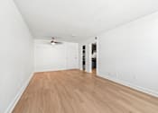 Thumbnail 2 of 27 - The Canvas Nashville living room with a ceiling fan and wooden flooring.