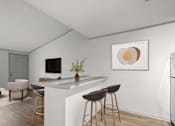 Thumbnail 3 of 36 - Retreat at Indian Lake apartments in Hendersonville, TN modern kitchen with a bar area and a framed artwork on the wall.