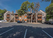 Thumbnail 35 of 37 - Fusion 35 parking lot with cars and apartment buildings in the background.