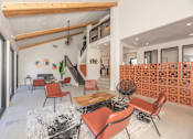 Thumbnail 28 of 37 - Fusion 35 clubhouse with a staircase and a wall of orange cubes.