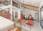 Thumbnail 30 of 37 - Fusion 35 clubhouse with a white ceiling and a staircase on the left side.
