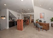 Thumbnail 31 of 37 - Fusion 35 clubhouse kitchen with a dining area and a workspace.