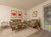Thumbnail 2 of 37 - Fusion 35 living room with a couch, chair, and pictures on the wall.