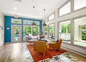Thumbnail 14 of 36 - Retreat at Indian Lake Hendersonville TN brightly lit leasing office with a blue wall and a red rug.