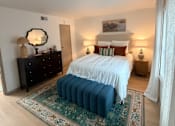Thumbnail 2 of 36 - Fusion Crossroads bedroom with a bed, dresser, and a rug.