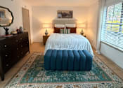 Thumbnail 3 of 36 - Fusion Crossroads bedroom with a bed, dresser, and mirror.