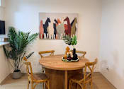 Thumbnail 5 of 36 - Fusion Crossroads dining room with a wooden table and chairs.