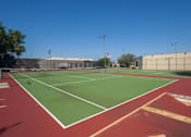 Thumbnail 17 of 32 - A tennis court with red and green surface and white lines at 1601 Eastchase Pkwy in Fort Worth, TX.