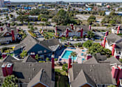 Thumbnail 19 of 41 - A bird's eye view of Fusion Orlando Apartments and a swimming pool.