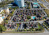 Thumbnail 41 of 41 - A bird's eye view of a residential area with houses and a road.