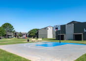 Thumbnail 34 of 43 - outdoor basketball court at fusion Fort Worth (previously Desert Sands) apartments in haltom city, Texas