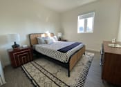 Thumbnail 3 of 18 - Fusion Hollywood (Alta Ink) bedroom with a bed, nightstand, and rug.