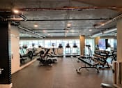 Thumbnail 5 of 18 - A gym with a variety of exercise equipment.