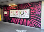 Thumbnail 18 of 18 - A wall with a mural that says Fusion Hollywood at Fusion Hollywood, luxury apartments in Hollywood, CA.