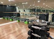 Thumbnail 8 of 18 - Fusion Hollywood (Alta Ink) fitness center with a variety of equipment including weights and resistance bands.