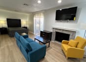 Thumbnail 21 of 60 - a living room with a couch and a tv