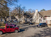Thumbnail 16 of 18 - A red truck is parked in a parking lot at Fusion Buckhead.