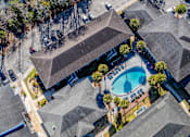 Thumbnail 16 of 38 - A bird's eye view of Mandarin Bay Apartments with a swimming pool.