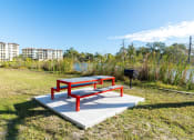 Thumbnail 19 of 23 - Mandarin Bay apartments bbq and picnic area on Goodby Creek in Jacksonville, Fl, 32257