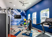 Thumbnail 22 of 36 - Fully equipped fitness center at Stadium 700 apartments in Arlington, Texas