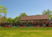 Thumbnail 24 of 49 - Community pool and pool house at the Retreat apts at Indian Lake  in hendersonville surrounded by black iron fence and lush green grass.