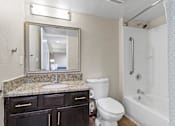 Thumbnail 9 of 41 - A bathroom with a sink, toilet, and bathtub at Fusion Orlando.