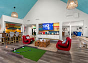 Thumbnail 25 of 41 - Fusion Orlando apartments clubhouse with a miniature golf course in the middle.