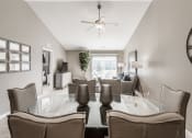 Thumbnail 14 of 16 - a dining room and living room with a large glass table and chairs